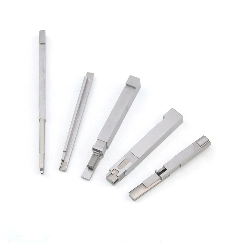 Five slim custom machined metal parts with different stepped ends and notched features